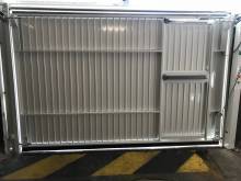 Porte basculante motorisée Doitrand avec portillon intégré à usage intensif et collectif près de Marseille